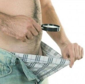 a man takes down his pants and wants to enlarge his penis with gel